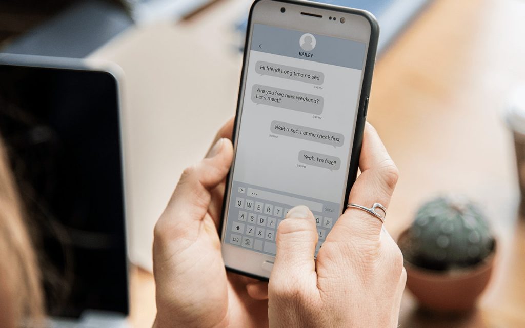 woman talking to a conversational chatbot through a phone